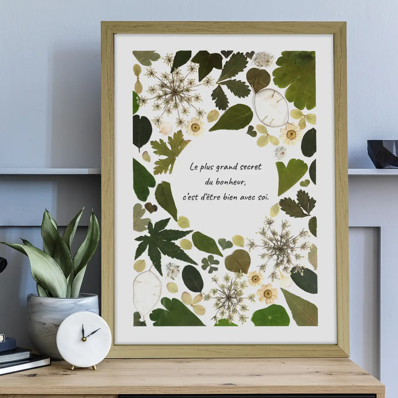 herbier végétal en feuillages pressés, citation en son centre